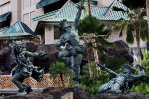 KD/“Kaha ka ‘Io me na Makani” (The Hawk soars with the Winds)                         Hilton Hawaiian Village, Gracefully striding the edge of a waterfall, these three, twice life size figures in bronze are dancing hula kahiko, the ancient style of Hawaiian dance. The two female dancers, the spirits of the wind, represent the dance and chant of Hawaiian hula. Together they are the winds that uplift the mighty ‘Io , the Hawaiian Hawk, the central male dancer, who represents the spirit of Hawai’i poised to take flight.
These images pay tribute to the importance of dance, chant and song in the rebirth and growth of Hawaiian culture. Together they celebrate the power of the hula connecting us with the spirit of the land, the Aina that is Hawaii.
Commissioned by Hilton Hawaiian Village
Completed May, 2001