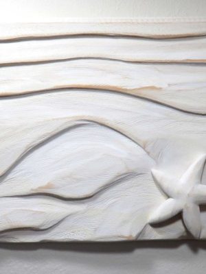 9" X 22" X 1.5", SAND SCRAWL is a wood sculpture that celebrates The Master Artisan's ever-changing sand-sculpture scrawled into the beaches of the world. The simple
yet gorgeous textures and forms carved into this endless sand-canvas are some of the most wondrous sights on the planet. Of course, The Master Artisan uses water
and wind to shape and smooth the infinite grains in a continual dance of creative beauty. Even the occasional starfish and sand dollar play into His artwork, interacting
with the forms in a sublime act of beauty-making. As a merely human artist, I'm joyfully humbled by the profound brilliance of The Master Artisan's technique and results.
To honor Him, I choose wood with a grain pattern that mirrors the undulating contours of sculpted sand. Then, I use various carving and sanding techniques to shape the
wood, taking care to account for its interplay with the sea creatures that I've placed in the composition. What He does in a moment takes me much, much longer. Still, I
hope that you appreciate the result and celebrate the original that inspired it.Radiant Pine forested from Sustainable-Sources